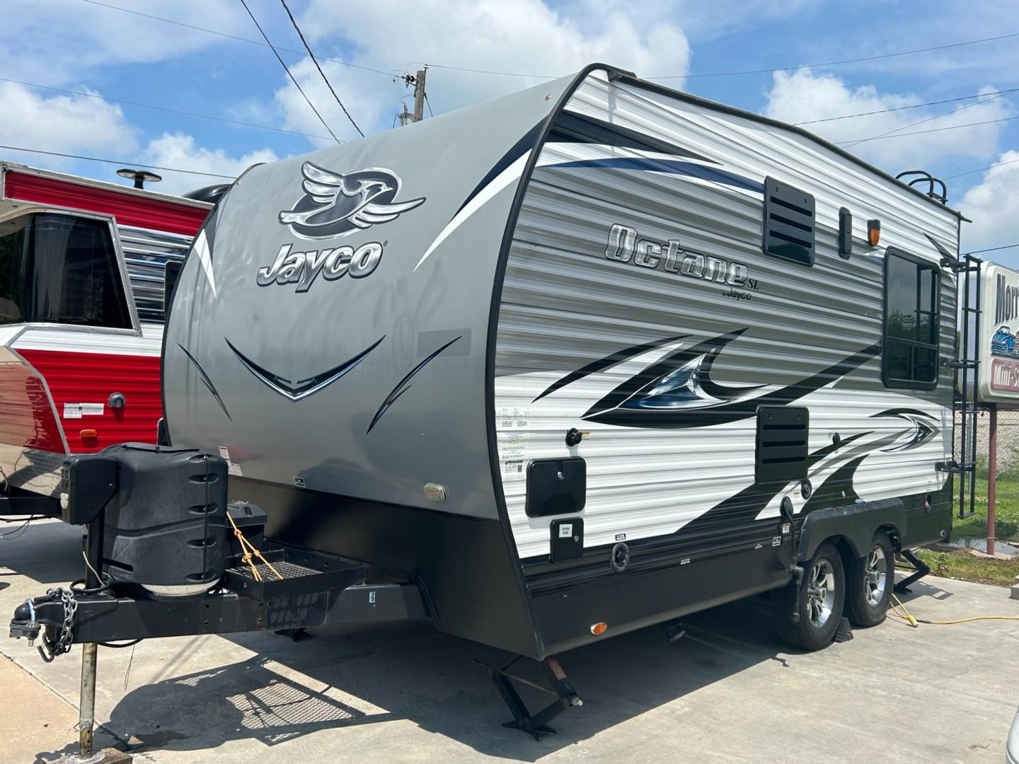 2018 Silver JAYCO OCTANE (1UJBJSBJXJ1) , located at 17760 Hwy 62, Morris, OK, 74445, 35.609104, -95.877060 - 2018 JAYCO OCTANE SUPER LITE 161 TOYHAULER IS 16FT, FEATURES STAINLESS STEEL APPLIANCES, SEAMLESS COUNTERTOPS, SPRING ASSIST REAR RAMP DOOR, SLIDE DOWN SCREEN DOOR, REAR ELECTRIC QUEEN BED WITH ROLLOVER SOFA, TUB/SHOWER COMBO, INTERIOR/EXTERIOR SPEAKERS, OUTSIDE SHOWER, AND AN OUTSIDE FILL UP STATIO - Photo#4